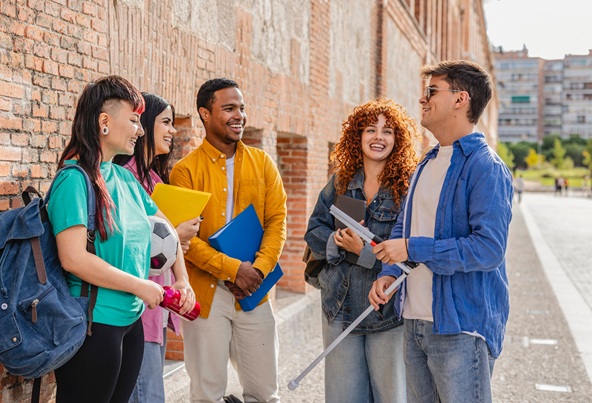 Diverse group of young people with varying abilities collaborating and learning together